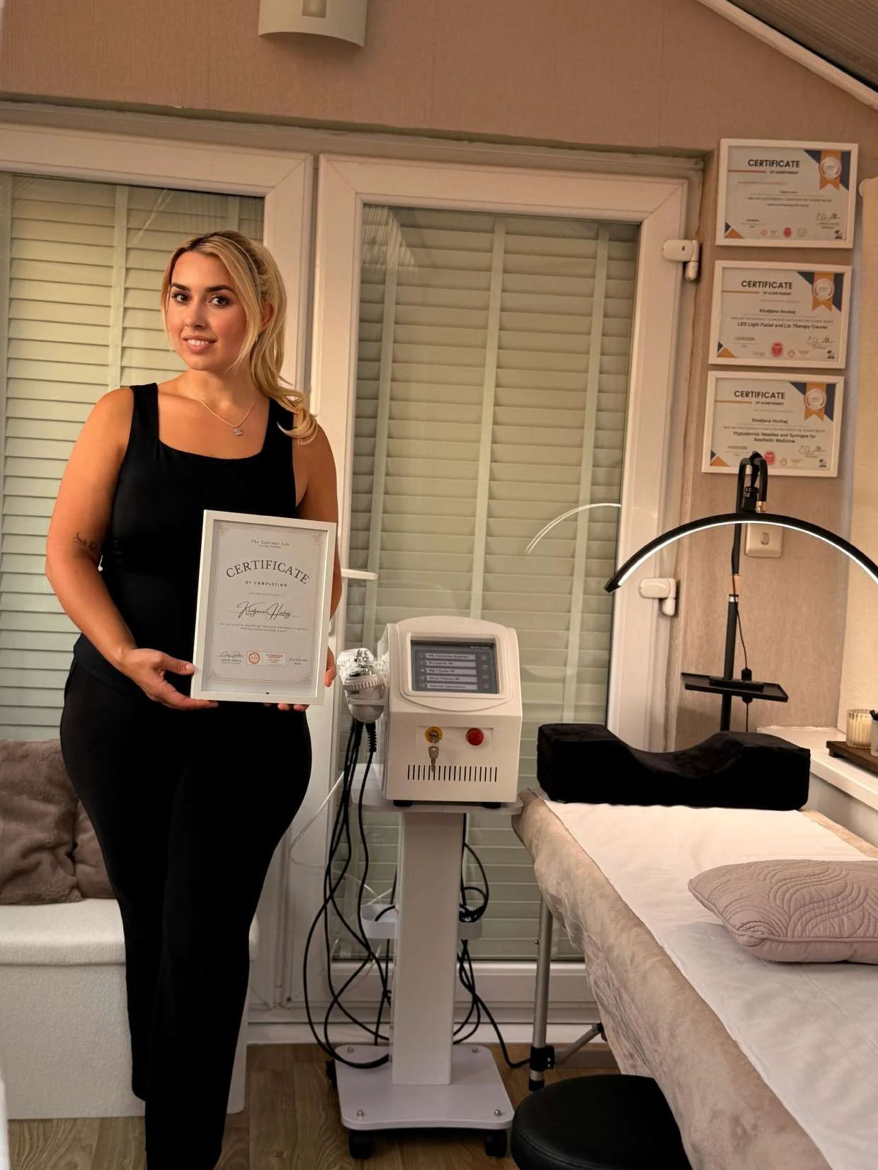 Ana standing in her clinic with professional equipment